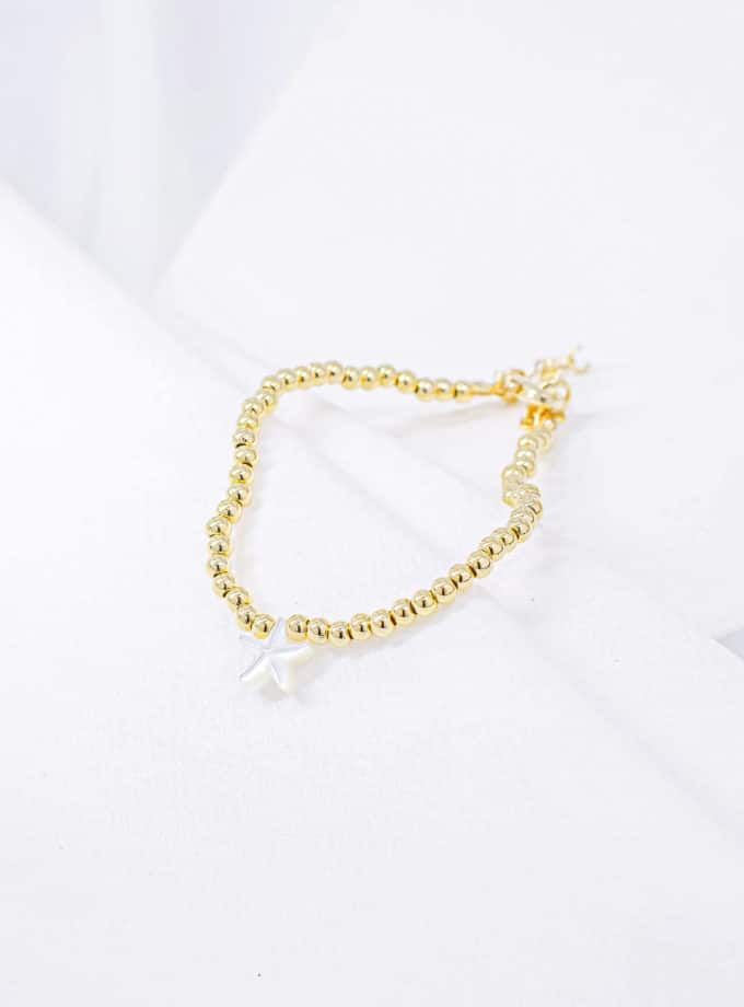 Bracelet en perles dorées étoile de mer