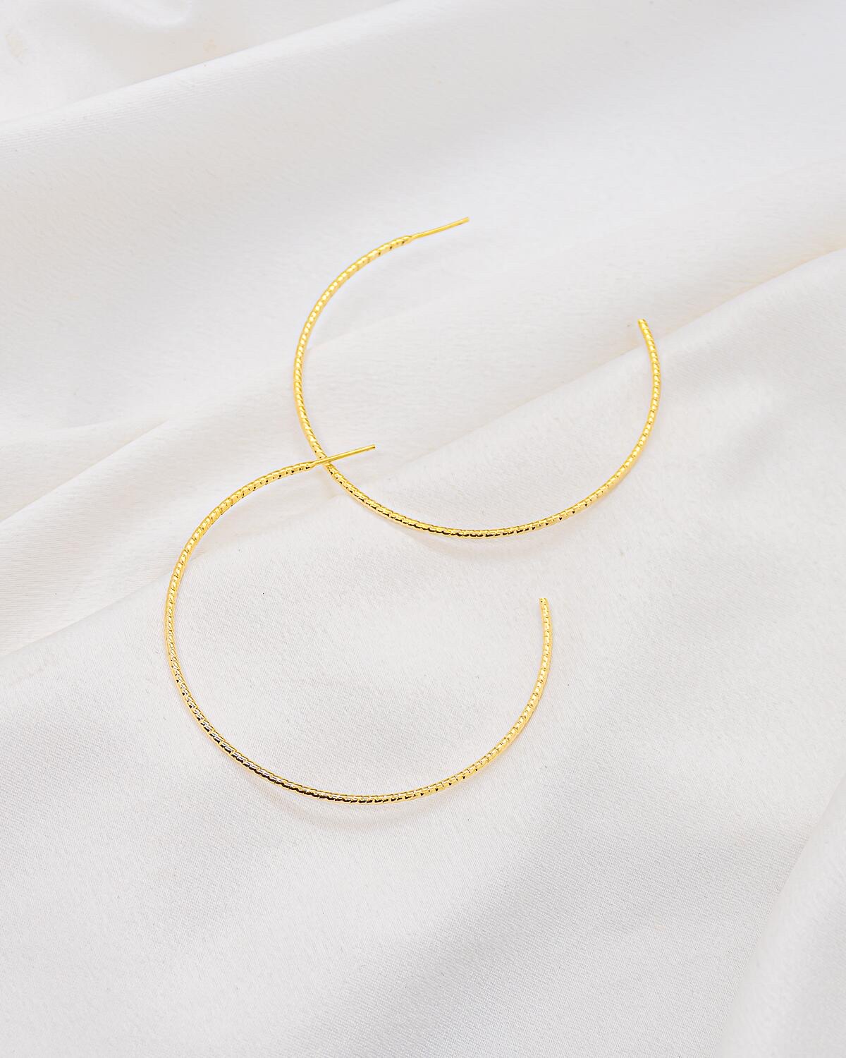 Gold open textured hoop earrings 6 cm – Product Shot on white fabric