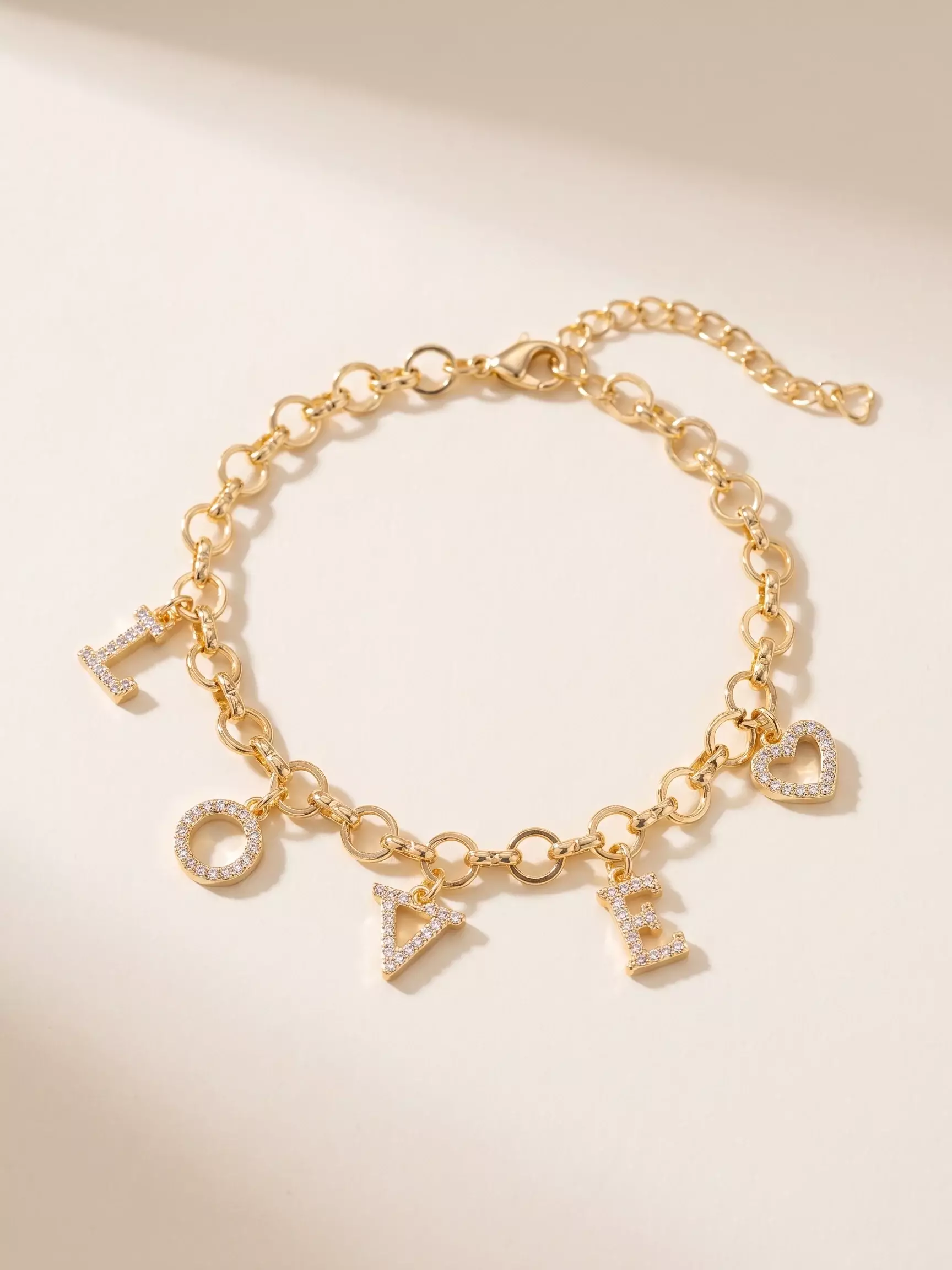 Round-link 'LOVE' crystal-set bracelet, laid flat, close-up view