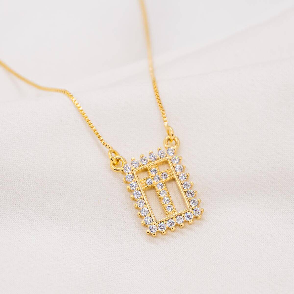 Gold-toned Venetian box chain necklace, rectangular plaque set with clear stones with an openwork cross