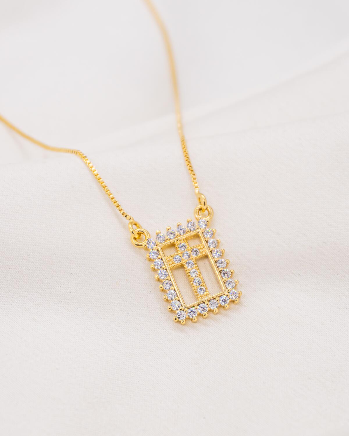 Gold-toned Venetian box chain necklace, rectangular plaque set with clear stones with an openwork cross