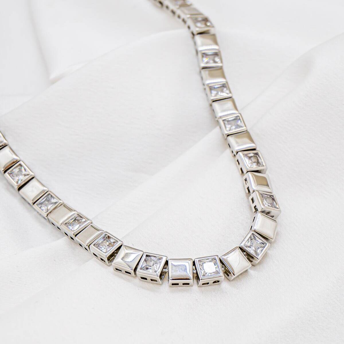Silver choker necklace alternating polished metal squares and set clear square stones